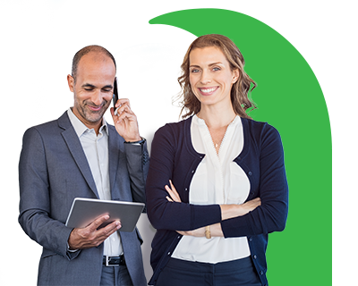 Two people smiling one of them looking at his tablet.