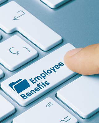 Benefits: Keyboard with words Employee Benefits as the enter button